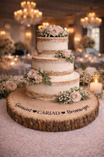 Load image into Gallery viewer, Personalised CARIAD Log Slice Cake Stand, Welsh Wedding Cake Stand, Rustic Wedding Cake Base, Engraved Names, Engagement Dessert Board