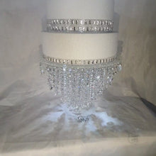 Load and play video in Gallery viewer, Chandelier cake stand [ crystal cake stand [ wedding cake stand + LED lights by Crystal wedding uk
