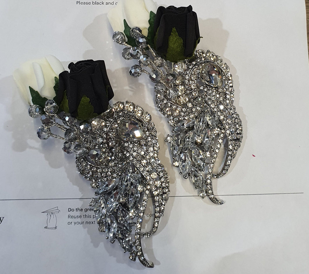 Crystal brooch buttonhole with ivory and black foam roses by Crystal wedding uk