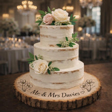 Load image into Gallery viewer, Personalized Wood Slice Cake Stand, Engraved Rustic Wedding Display stand, Personalised Engraved log Slice with Daffodils
