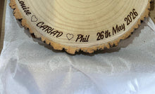 Load image into Gallery viewer, Personalised CARIAD Log Slice Cake Stand, Welsh Wedding Cake Stand, Rustic Wedding Cake Base, Engraved Names, Engagement Dessert Board
