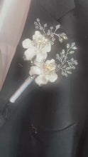 Load and play video in Gallery viewer, White Flower Rhinestone Wedding Boutonniere: Silver Ribbon Stem
