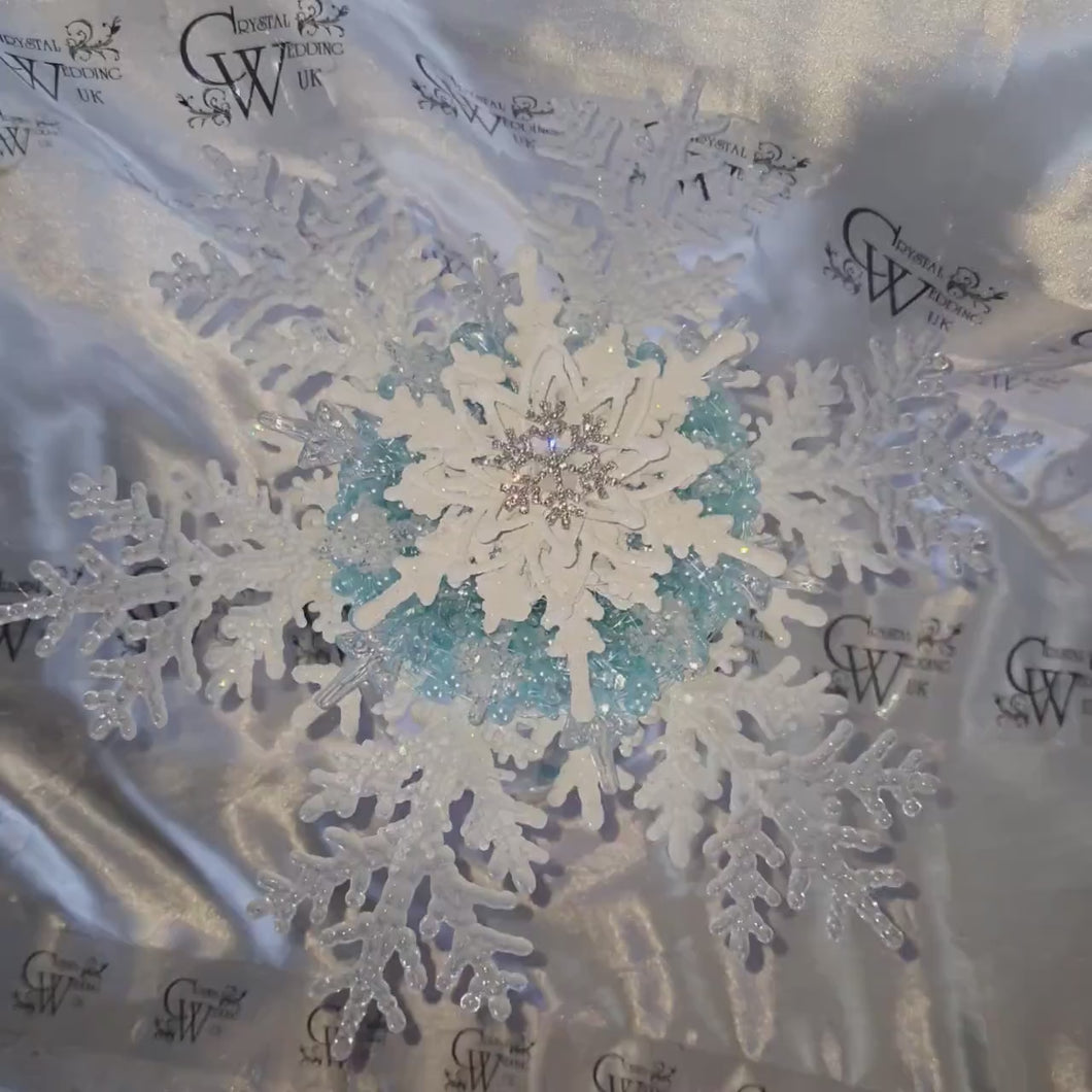 Snowflake bouquet with frozen blue accent for a Winter wedding bridesmaid by Crystal wedding uk